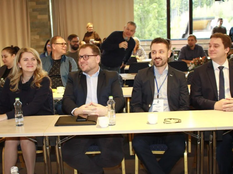 A panel seated at a conference table