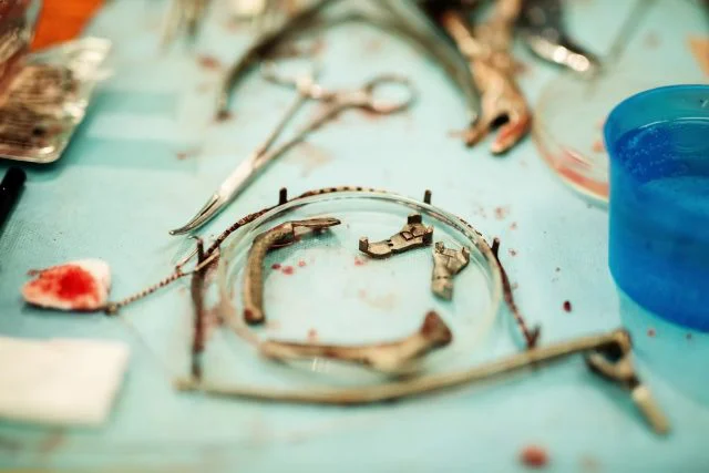 Surgical instruments laid out on a sterile drape
