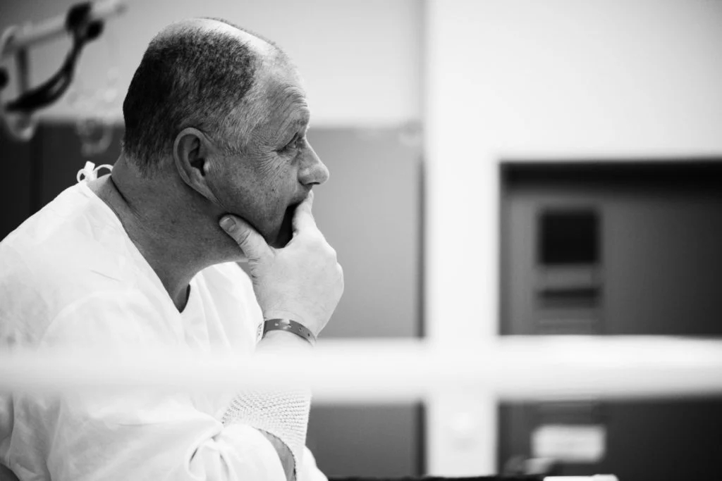 A surgeon thinking over a case