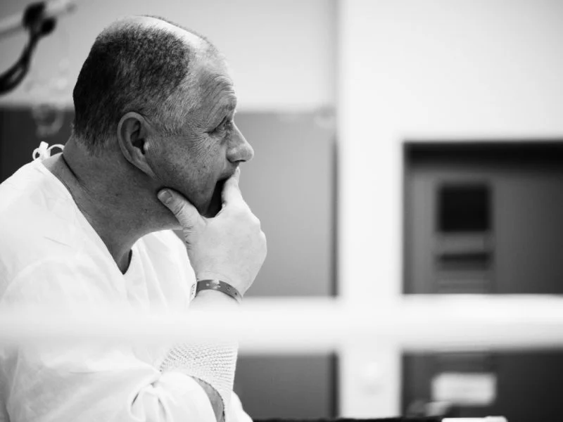 A surgeon thinking over a case